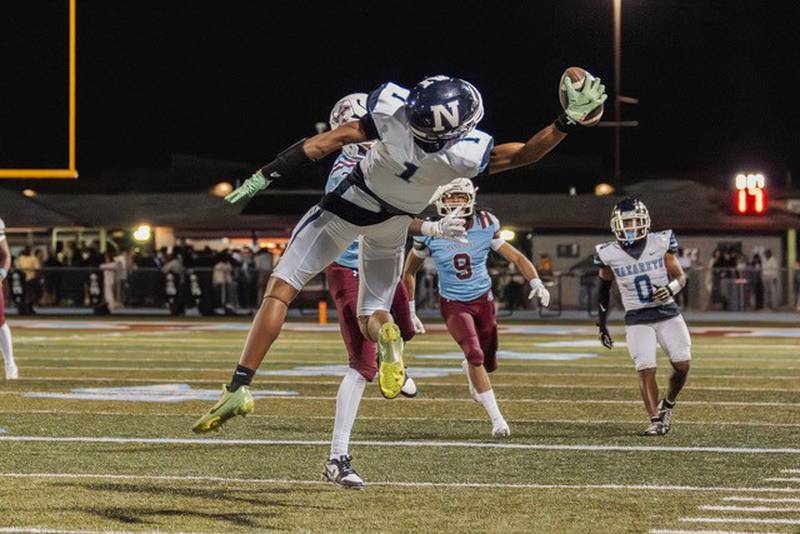 Nazareth's Trenton Walker makes a one-handed grab during a varsity football game earlier this season.
