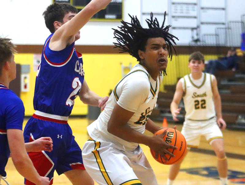 Crystal Lake South’s David McFadden, right, works under the hoop against Lakes in varsity boys basketball Hinkle Holiday Classic action on Friday, Dec. 26, 2025, at Jacobs High School in Algonquin.