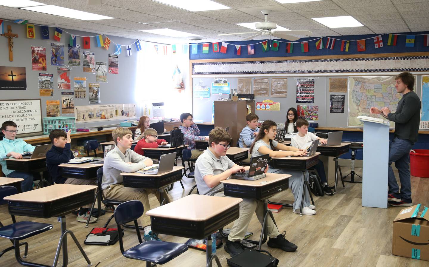 Dominic Giabozzi teaches seventh-graders at Trinity Catholic Academy on Tuesday, March 12, 2025 at Trinity Catholic Academy.