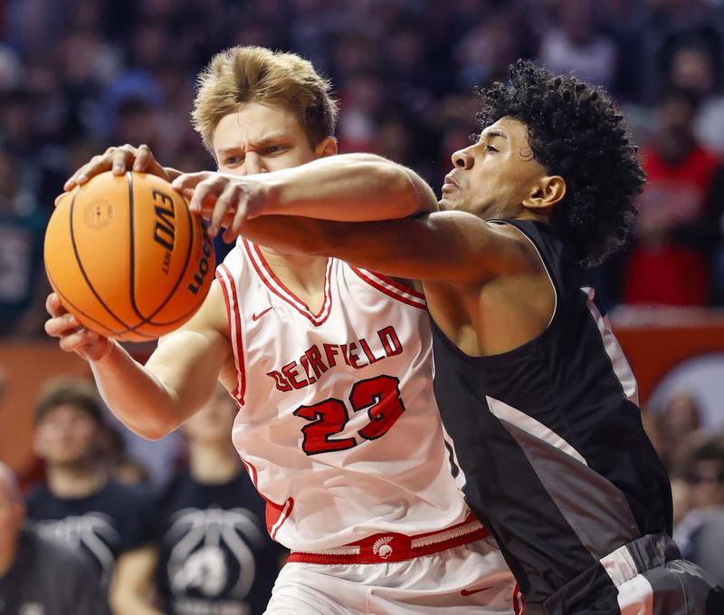 Deerfield's Chase Arenberg (23) battles Kaneland's Jalen Carter (10) for a rebound during the IHSA Class 3A boys basketball state semifinal Friday, March 13, 2026 at the State Farm Center in Champaign.