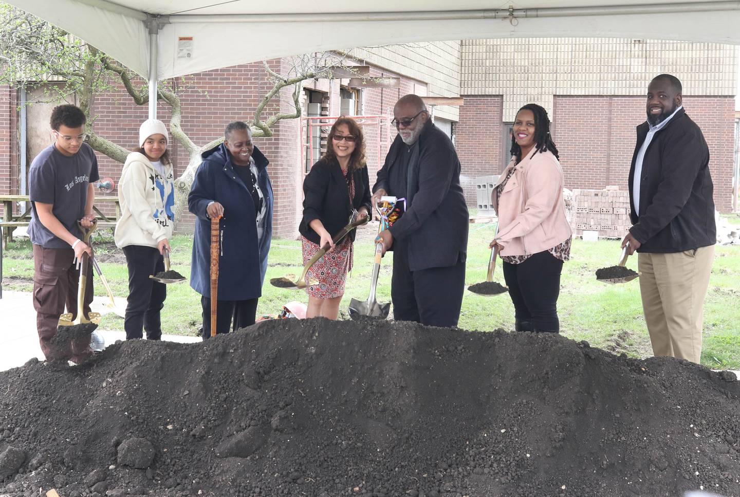 Members of the Mitchell Family, including patriarch Leroy Mitchell, (third from left) are joined by District 428 Superintendent Minerva Garcia-Sanchez (middle) Thursday, April 11, 2024, to break ground for the new Dr. Leroy A. Mitchell Elementary School. The school will be located at 1240 Normal Road in DeKalb.
