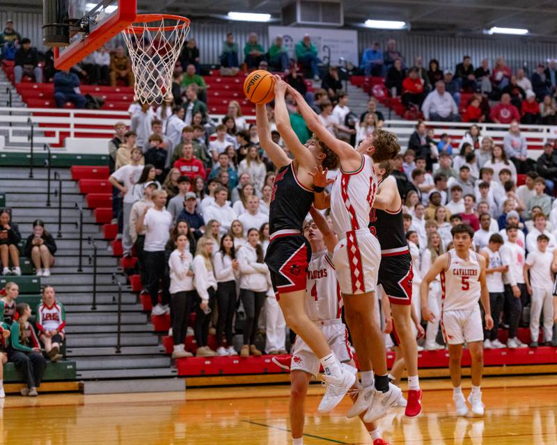 Hall's Chase Sterling attempts to put a shot up against LaSalle-Peru High School during the game at Sellett Gymnasium on December 2, 2025 at LP High School.