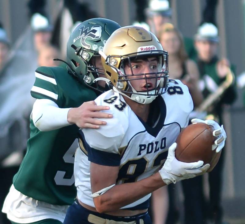 Polo's Mercer Mumford (83) runs with the ball against West Carrroll in 8-man football action in Mt. Carroll on Friday, Sept. 12, 2025.