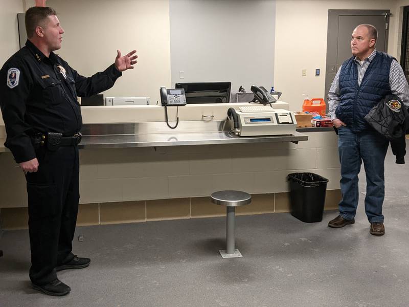 Sandwich Police Chief Kevin Senne gave Sandwich 4th Ward Alderman Fred Kreinbrink a tour of the new police station during a Jan. 29 community meeting.