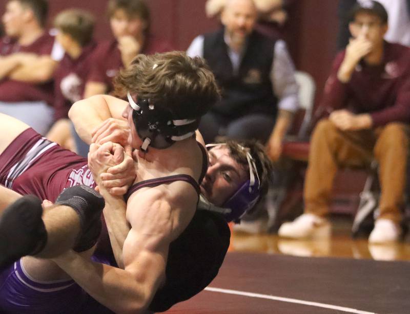 Prairie Ridge’s Matt Moritz, front, battles Hampshire’s Mike Brannigan at 157 pounds in varsity boys wrestling on Thursday, Dec. 4, 2025, at  Prairie Ridge High School in Crystal Lake.