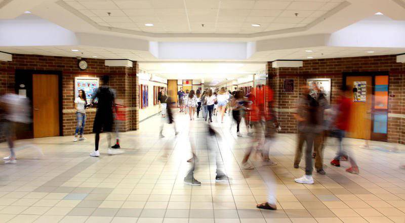 File photo: Oswego High School students head to class during a passing period at the school.