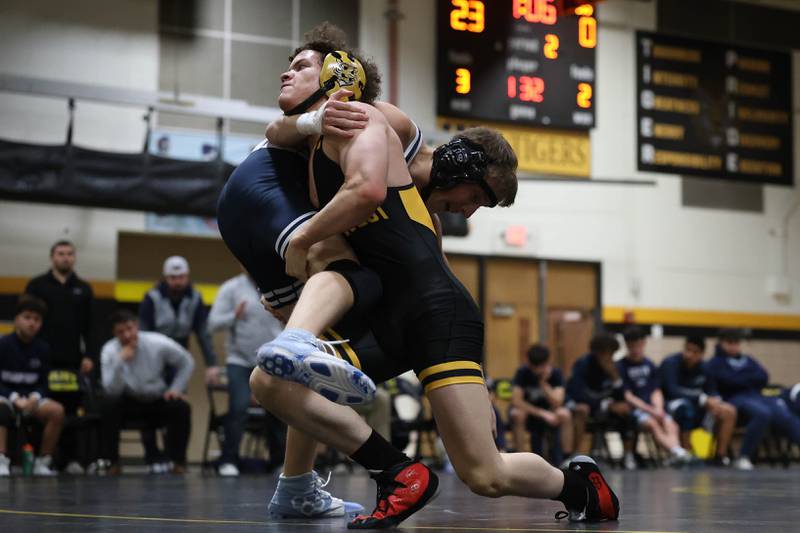 Joliet West’s Malakai Lancaster-Williams brings down Plainfield South’s Nathan Cameron in the 132 pound match on Wednesday, Dec. 3, 2025 in Joliet.