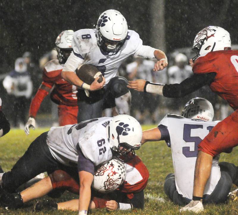 Wilmington's Kyle Farrell jumps the pile in their away game against Streator at Dieken Stadium on Friday, Oct. 14, 2022 in Streator.