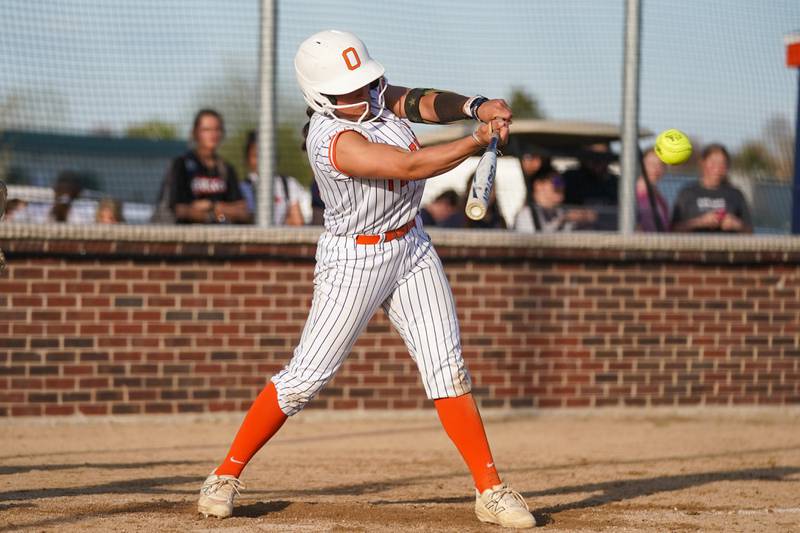 Oswego’s Kiyah Chavez (10) slaps an RBI single against Minooka during a Southwest Prairie Conference softball game at Oswego High School on Wednesday, April 23, 2025.