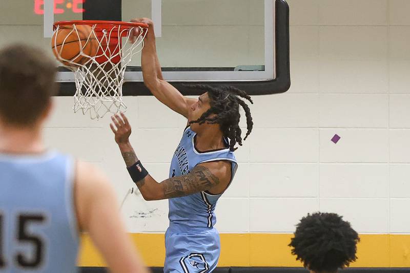 Kankakee’s Lincoln Williams throws down a dunk against Joliet West on Wednesday, Feb. 18, 2026 in Joliet.