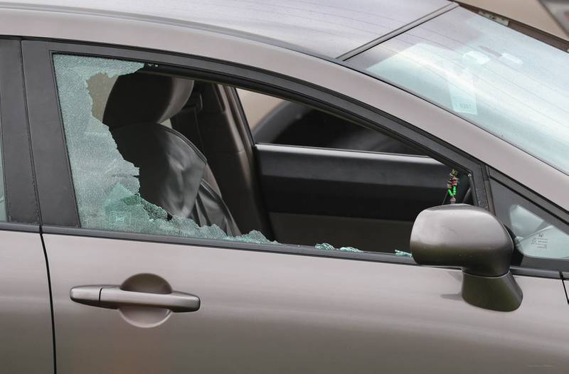 A Honda sedan with a shattered window sits in the westbound lanes of Interstate 88 Monday, April 27, 2026, as police investigate an incident on I-88 just west of Keslinger Road in Maple Park.