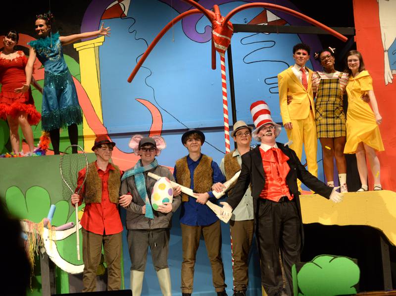 Oregon High School Senior Isaac Ebert (right) sings as The Cat in the Hat with other cast members during a scene from the school's presentation of "Seussical The Musical" on Friday, March 14, 2025 in the OHS Theater..