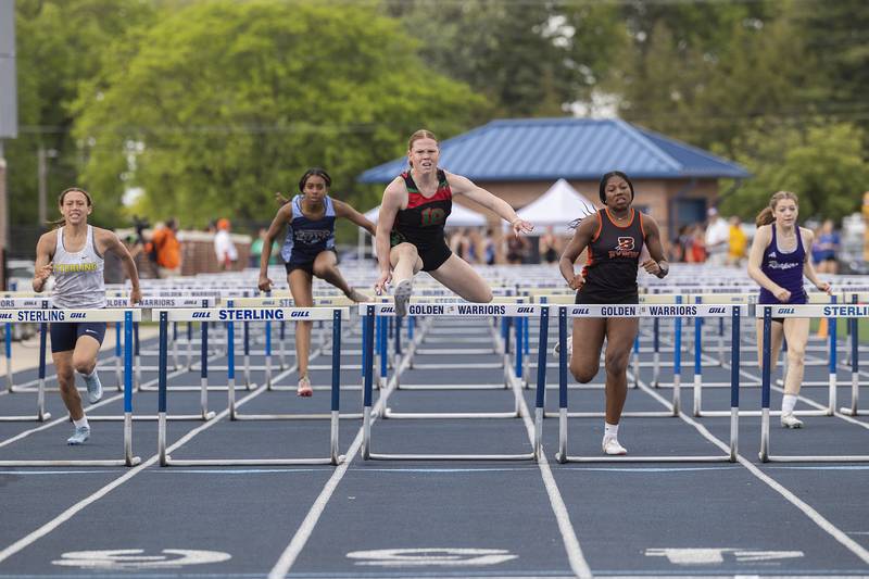 L-P’s Elli Sines soars over the last hurdle in the 100 hurdles Wednesday, May 14, 2025, during Sectionals at Sterling High School.