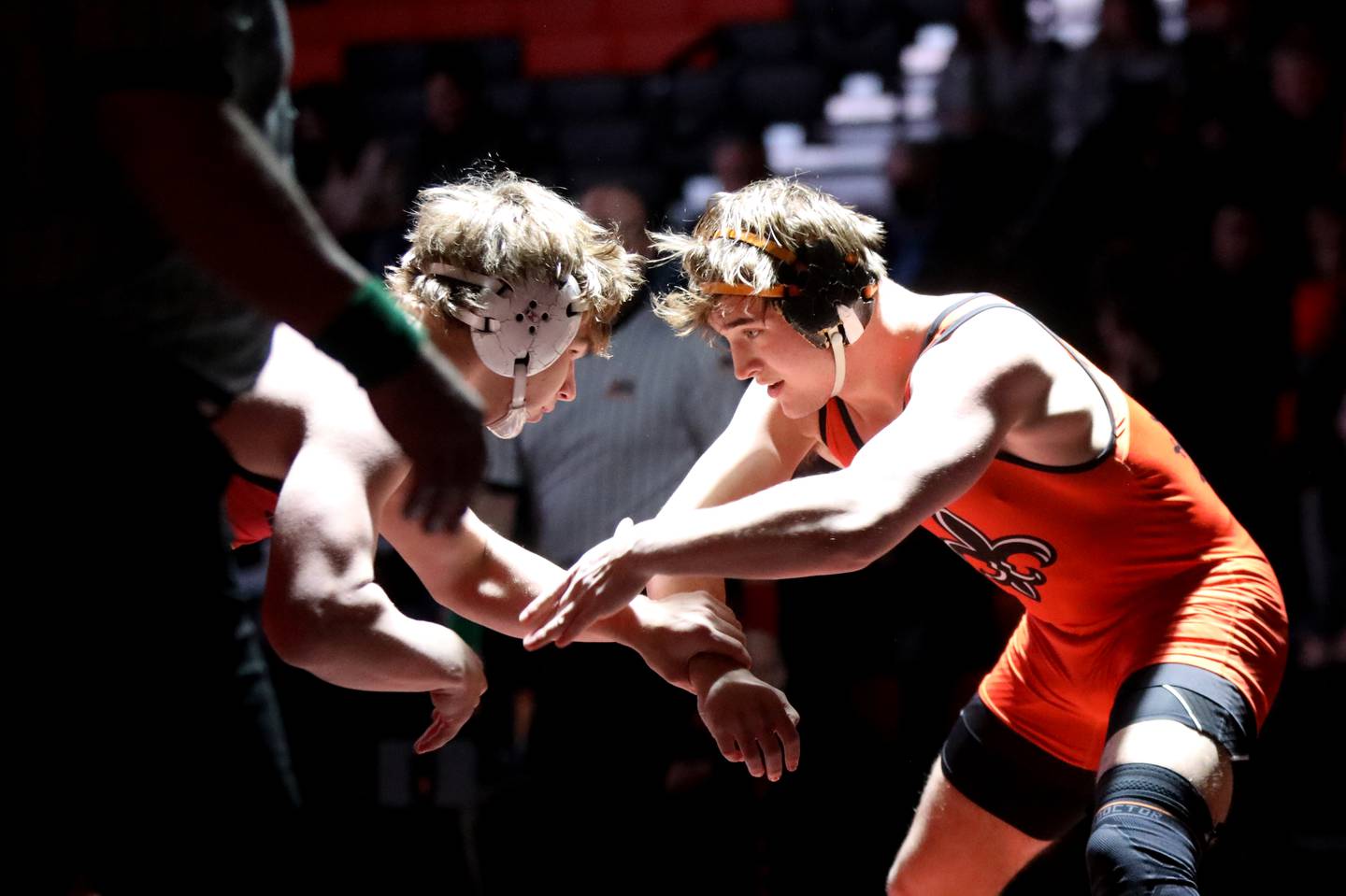 St. Charles East’s Brandon Swartz (right) wrestles Batavia’s Asher Sheldon in the 215-pound weight class during a dual meet in St. Charles on Thursday, Jan. 4, 2024.