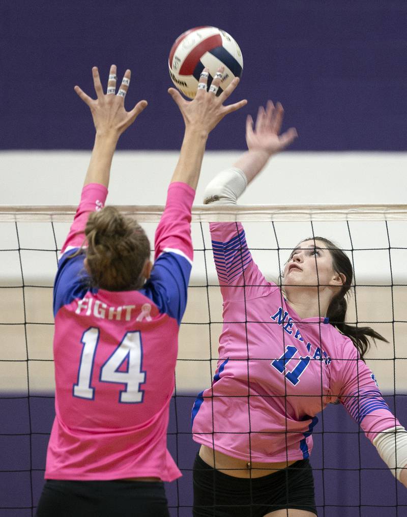 Newman’s Isabelle Lanning hammers a shot against Dixon’s Leah Carlson Thursday, Oct. 2, 2025.