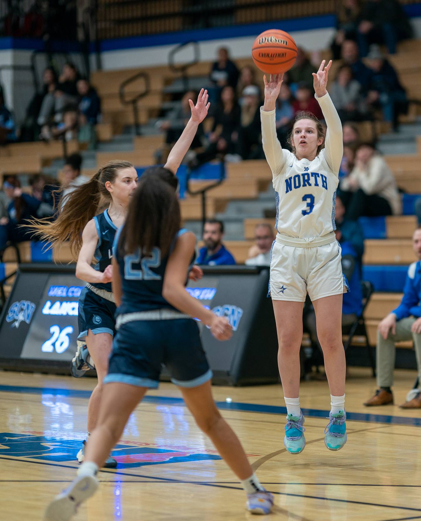 St.Charles North's Alyssa Hughes (3) shoots a three-pointer against Lake Park during a basketball game at St.Charles East High School on Wednesday, Dec 21, 2022.