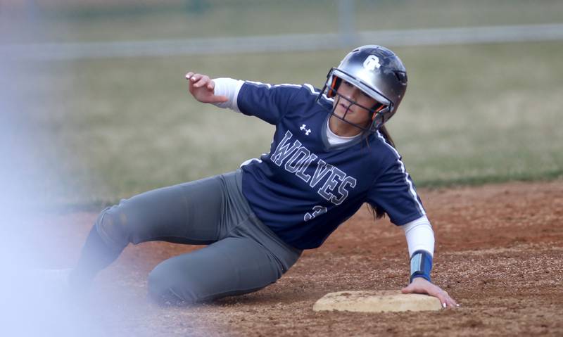 Oswego East’s May Pasqualini slides safely into second base during a game at Waubonsie Valley on Friday, April 1, 2022.