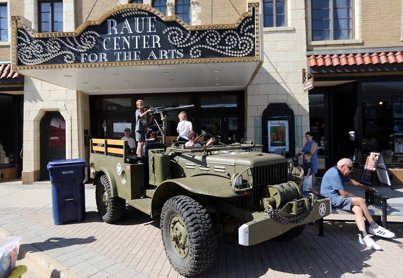Drew Jacobson, 8, of Crystal Lake plays with the gun on an army vehicle during the Johnny Appleseed Festival on Saturday, Sept. 27, 2025, in downtown Crystal Lake. The festival featured live performances, food and family-friendly activities.