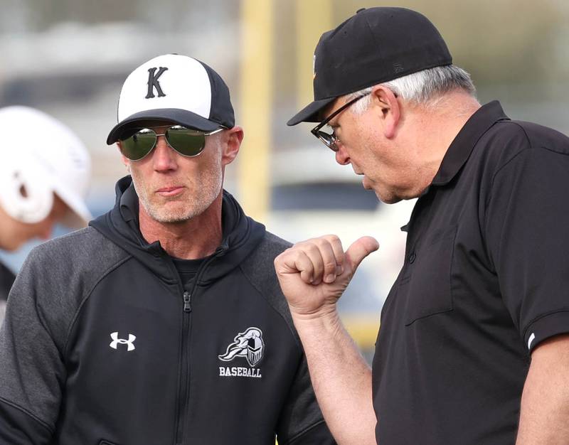 Kaneland head coach Brian Aversa talks to an umpire after a call goes against his team during their game against Sycamore Monday, April 22, 2024, at the Sycamore Community Sports Complex.