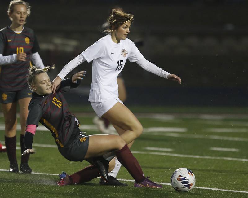 Richmond-Burton’s Jordon Otto tries to take the ball away from McHenry’s Maya Gill during a non-conference girls soccer match Thursday, March 16, 2023, at Richmond-Burton High.