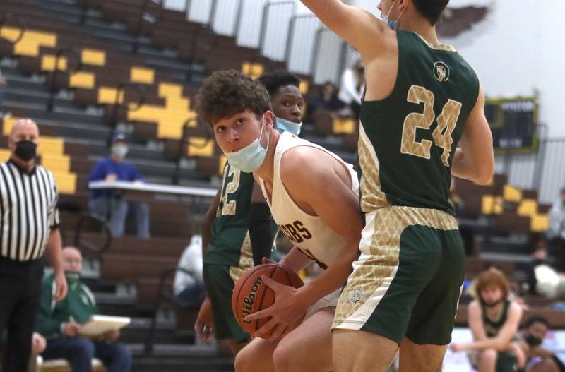 Jacobs’ Grant Stec looks for a path to the hoop during boys varsity basketball against Rockford Boylan at Algonquin Saturday afternoon.