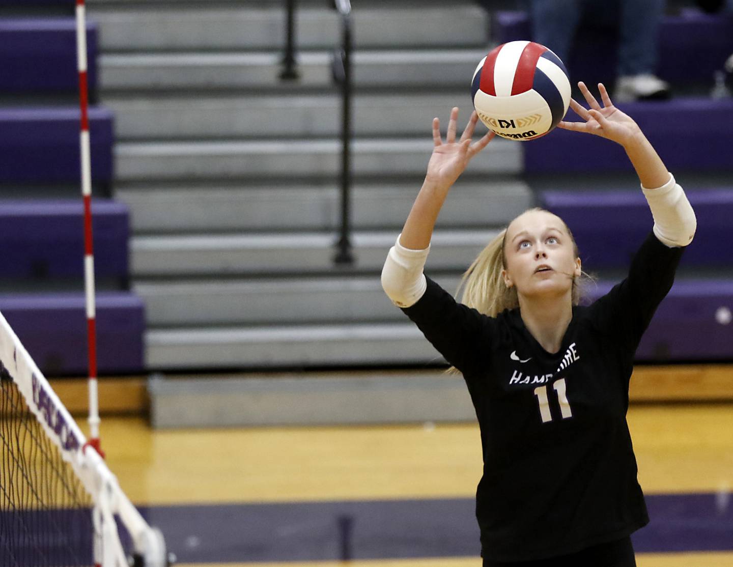 Hampshire's Jorah Rutter sets the ball during a Fox Valley Conference volleyball match against Crystal Lake Central on Tuesday, Sept. 24, 2024, at Hampshire High School.