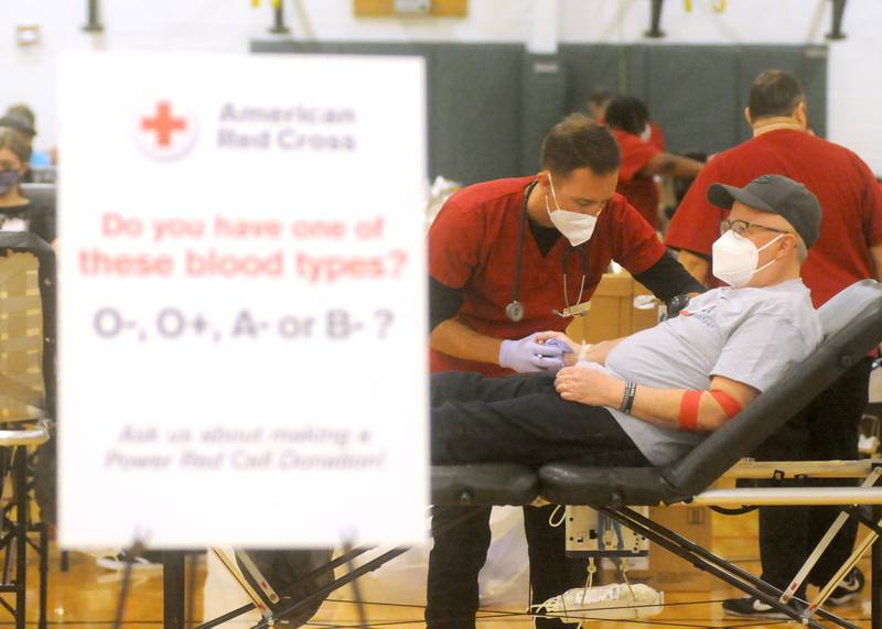 Steve Vanscoyoc donates blood during the third annual Jake Keltner Memorial Blue Blood Drive on Law Enforcement Appreciation Day, Sunday, Jan. 9, 2022, at the Sage YMCA. McHenry County sheriff's Deputy Jake Keltner was killed in the line of duty serving an arrest warrant in March 2019 in Rockford. All 230 appointments to donate blood were filled this year.