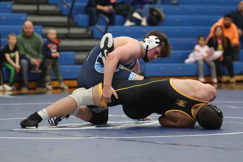 Plainfield South’s Colin Bickett rolls Joliet West’s Zachary Cronk in the 175-pound match on Wednesday, Dec. 11, 2024 in Plainfield.