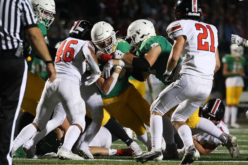 Providence’s CJ Hill powers his way forward on a run against Lincoln-Way Central on Friday, Sept. 6, 2024 in New Lenox.