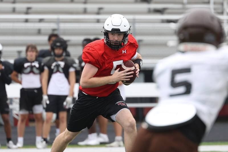 Plainfield North’s Connor Gregory rolls out to pass during a scrimmage against Joliet Catholic on Thursday, July 13th, 2023 at Plainfield North.