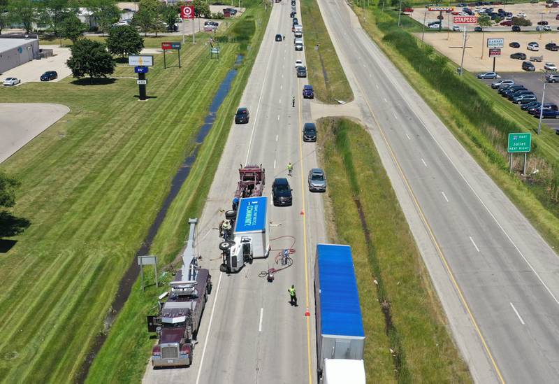 Crews work the scene of a semi truck crash on Friday, June 14, 2024 near the intersection of 38th Street and Illinois 251 in Peru. A Goodwill semi truck overturned and extrication was needed. The crash happened shortly before 11:30a.m. Illinois Route 251 was down to one lane. Peru police believe injuries were not serious.