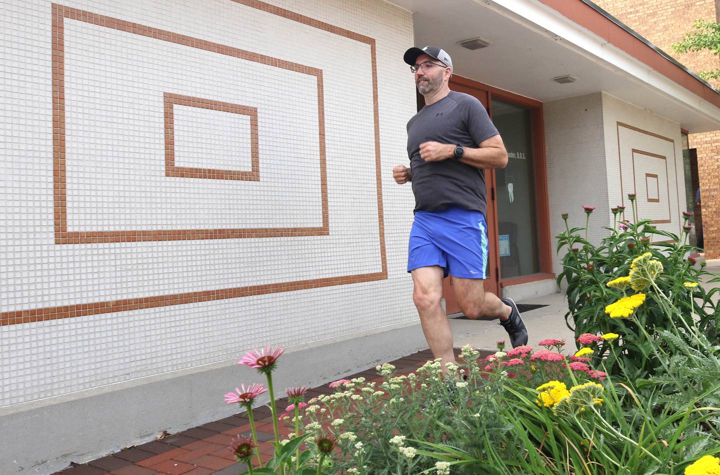 Shawn Beck, from DeKalb, runs south Wednesday, June 28, 2023, on Second Street in DeKalb. Beck recently completed his goal of running every street in DeKalb County.