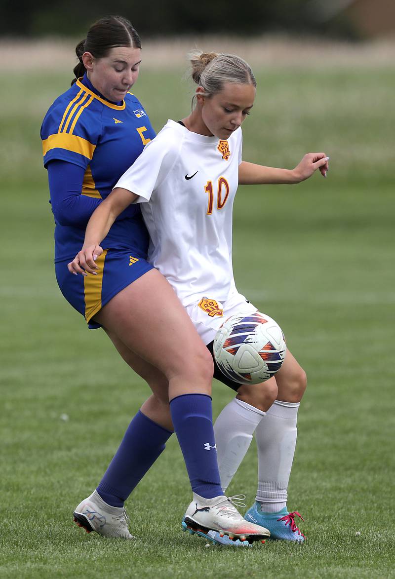 Richmond-Burton's Madelyn Seyller tires to control the ball in front of Johnsburg's Elaina Moss during the Kishwaukee River Conference Girls Soccer Tournament Championship match on Wednesday, May 6, 2026, at Johnsburg High School.