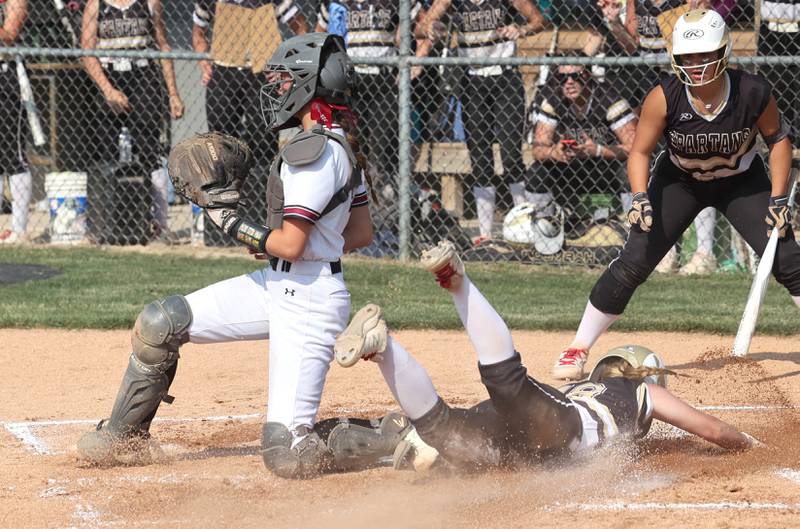 Sycamore's Addison McLaughlin scores behind Antioch's Grace Green during their Class 3A supersectional game Monday, June 5, 2023, at Kaneland High School in Maple Park.