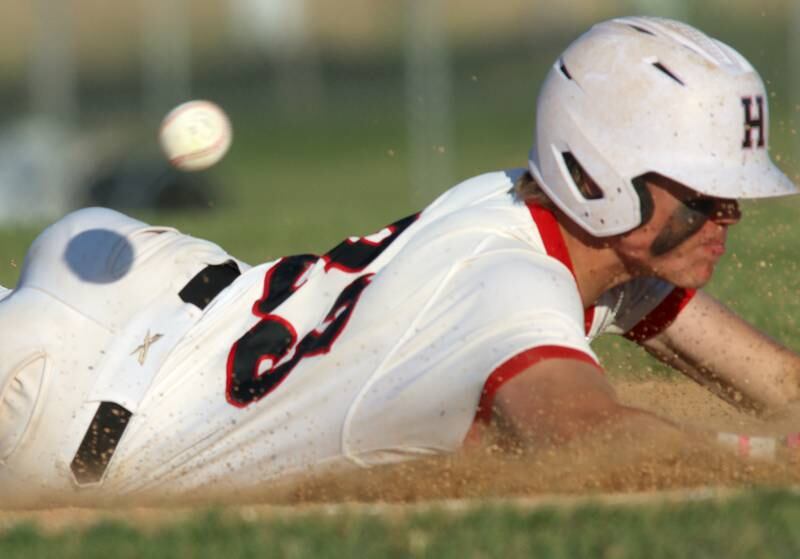 Huntley’s Kyle Larson arrives just ahead of the ball on a triple against Barrington in sectional semifinal baseball action at Hampshire Wednesday.