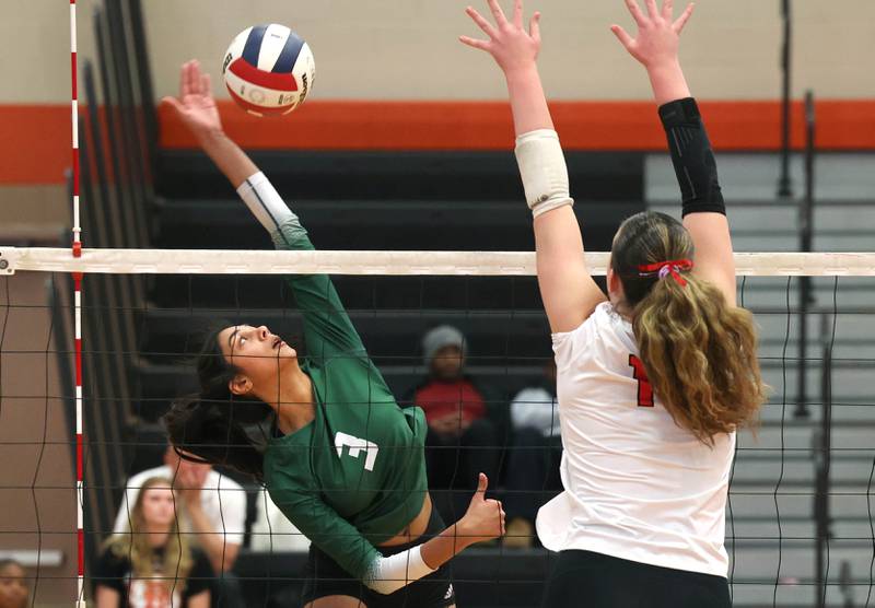 Fremd's Akshara Jay tries to spike the ball by Huntley's Georgia Watson Monday, Nov. 11, 2024, during their Class 4A supersectional match at DeKalb High School.