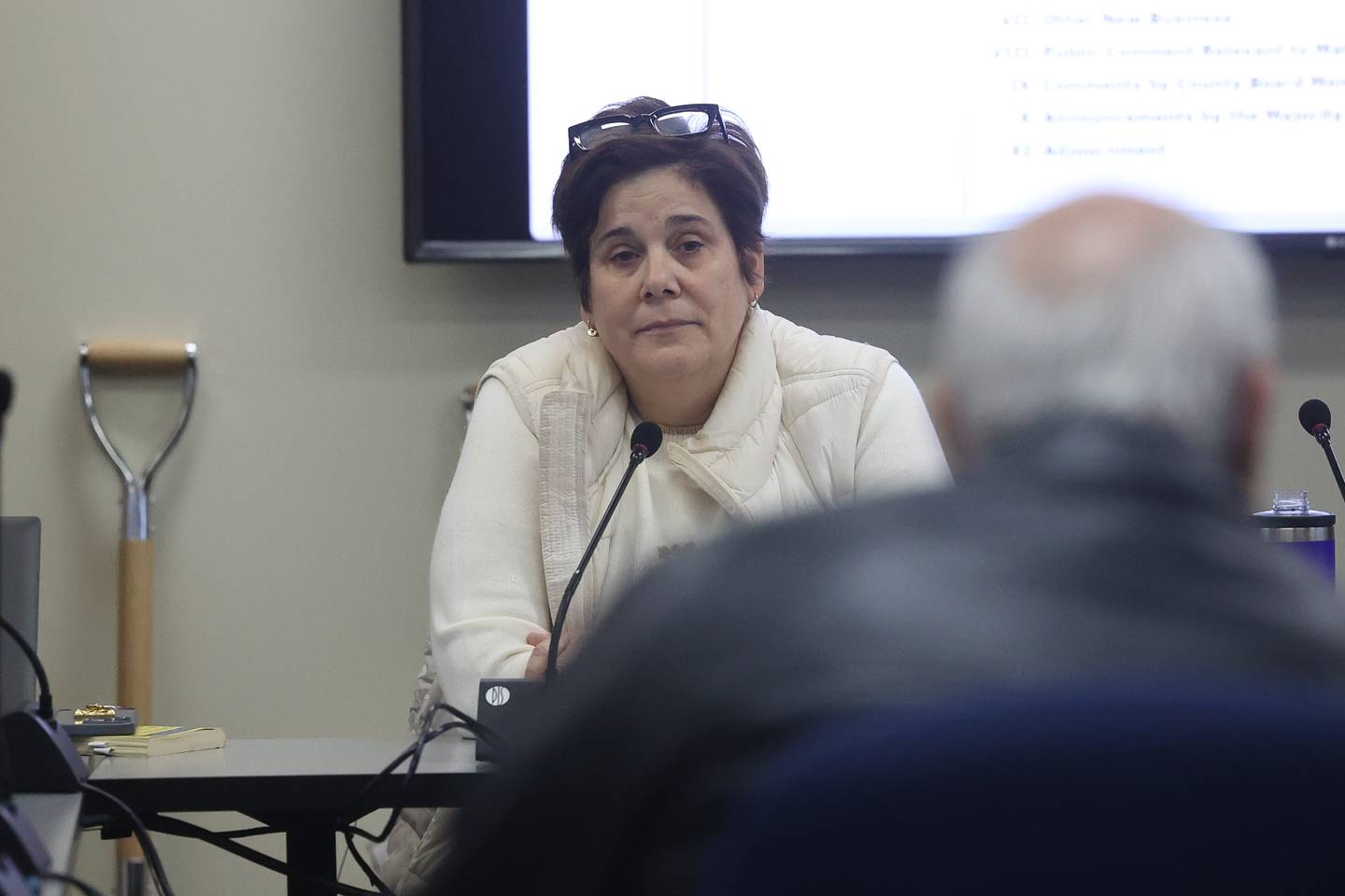 Will County Executive Jennifer Bertino-Tarrant listens to Nick Macris make public comments at the Will County board’s special meeting to discuss the wether or not to halt the demolition of the old Will County courthouse on Tuesday, Jan. 2nd, 2024 in Joliet.