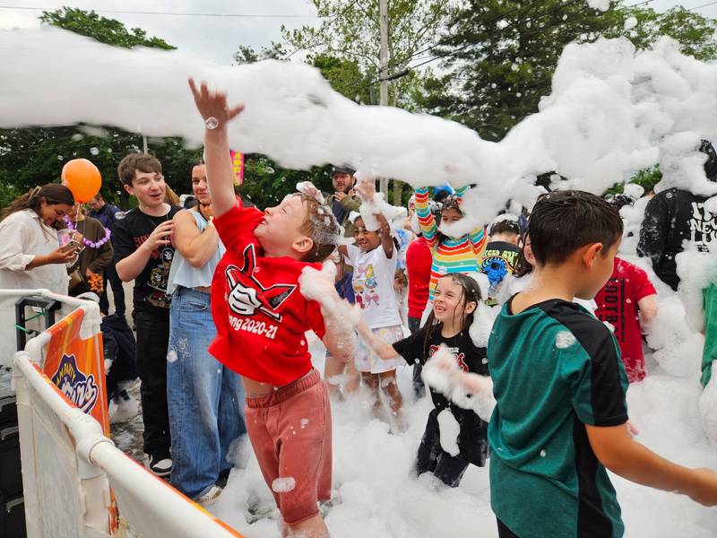 Kids play in the foam pit at Yorkville's "School's Out Beach Party" in Town Square  Park.