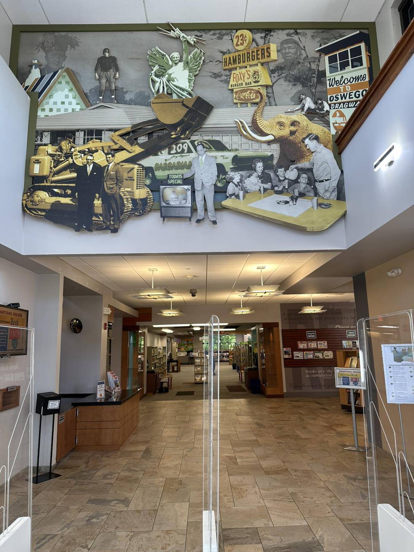 A wood relief mural celebrating the history of Oswego and Montgomery was recently installed near the entrance to the campus, located at 32 W. Jefferson St. in downtown Oswego.