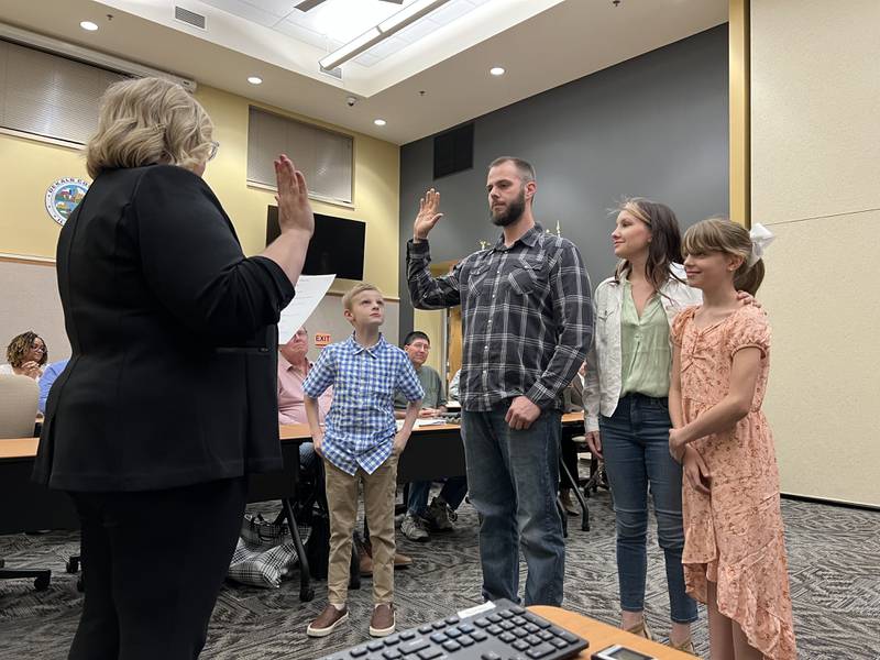 Standing along side his wife and children, Joseph Marcinkowski was sworn in as DeKalb County Board's newest member on Wednesday, April 12.