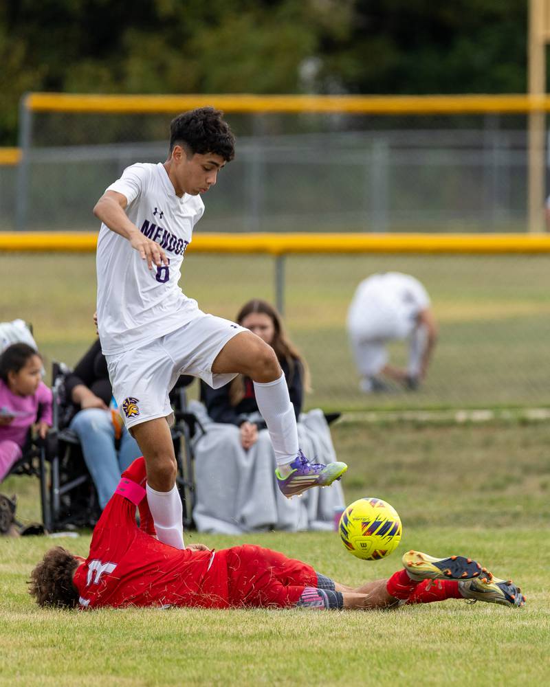 Danny Garcia (6) of Mendota maneuvers ball over Isaac Fowler (13) of Streator after he attempts to slide tackle Garcia on Saturday, Aug 30, 2025 at the James Street Recreation Area in Streator.