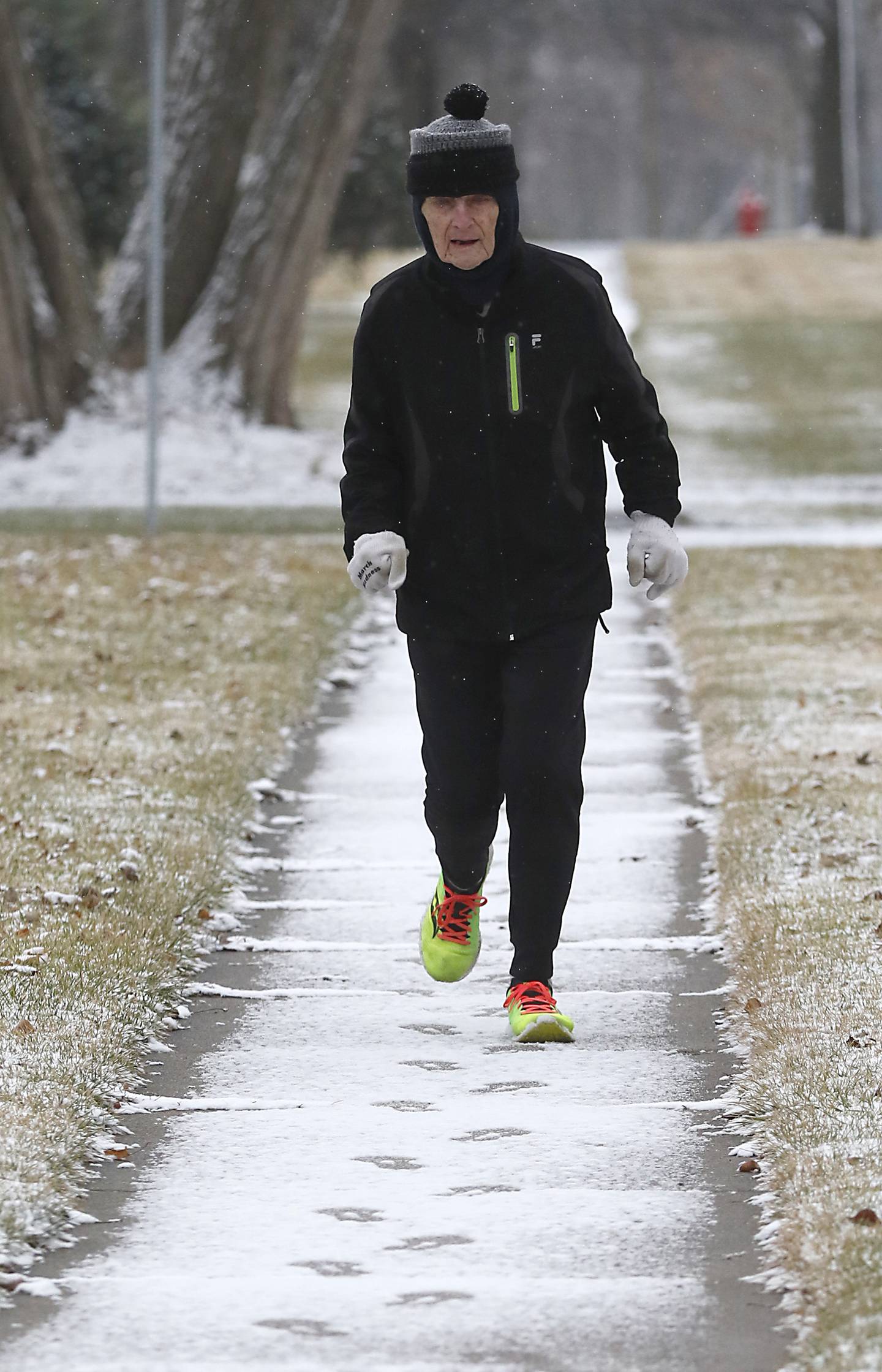 George Diedrichs, a local runner who just celebrated his 90h birthday, runs along Barlina Road in Crystal Lake on Thursday, Jan. 5, 2023, during his daily three mile run.