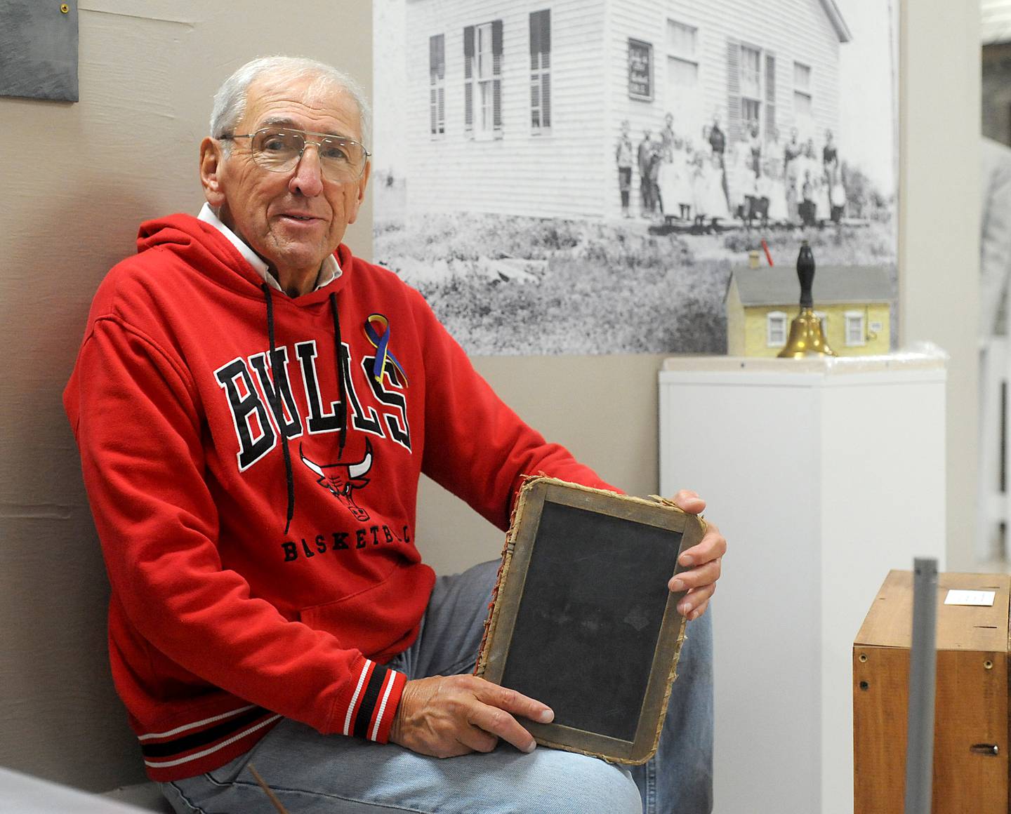 Bob Frenz, who is a retired educator from Huntley, is photographed with the McHenry County Historical Society and Museum’s exhibit about one-room schools. He has written about the history of schools in McHenry County and specializes in how one-room schoolhouses consolidated and modernized in the ‘40s and ‘50s.