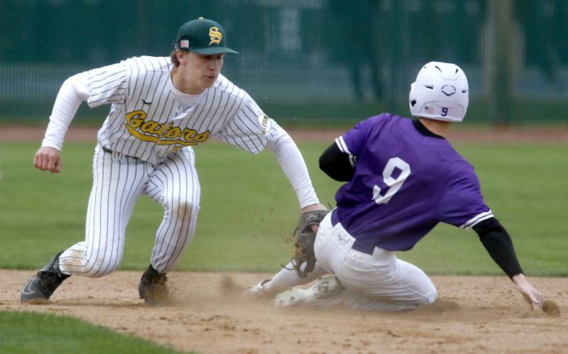 Crystal Lake South's Carson Trivellini tags out Hampshire's Nicholas Lueders as he tries to steal second base during a Fox Valley Conference baseball game on Monday, April 29, 2026, at Crystal Lake South High School.