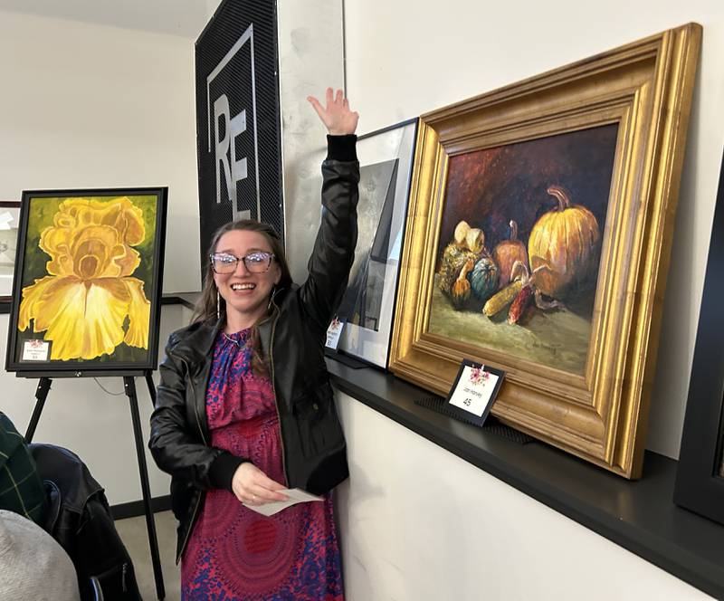 A very happy, Amanda Bordner of Oregon, stands by the Jan Harvey paiting she selected during the Serenity Hospice and Home’s Fourth Annual Art Dash fundraiser on Wednesday, April 9, 2025, at River’s Edge Experience, 103 S. First St., Oregon.