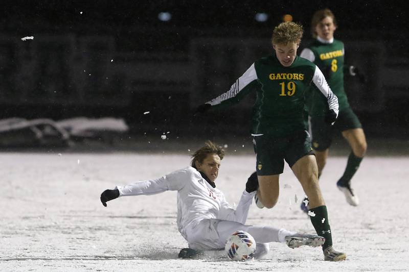 Timothy Christian's Caleb Bode tries to kick the ball away from Crystal Lake South's Mason Ross during the IHSA Class 2A Grayslake Central Supersectional soccer match on Tuesday, Oct. 31, 2023, at Grayslake Central High School.