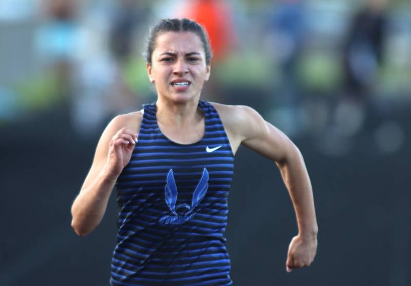 Woodstock’s Sophia Mendoza completes the 100-meter dash in KRC Conference Track Meet action at Marengo High School in Marengo on Tuesday, May 6, 2025.