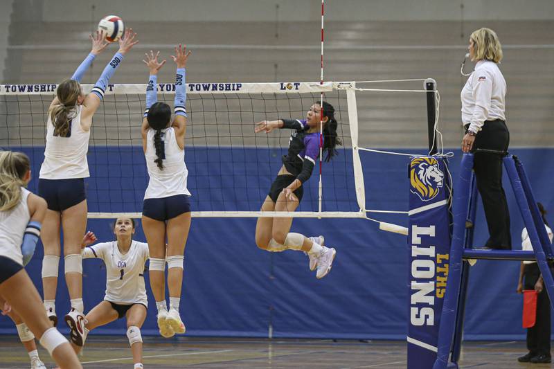 Downers Grove North's Nicole Liu (6) watches her kill during Class 4A Lyons Sectional Semifinal volleyball match between Downers Grove South at Downers Grove North. Nov 4, 2025 in La Grange.
