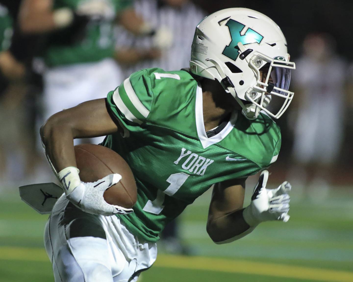York's Kelly Watson (1) runs with the ball during football game between Hinsdale Central at York. Oct 8, 2021.