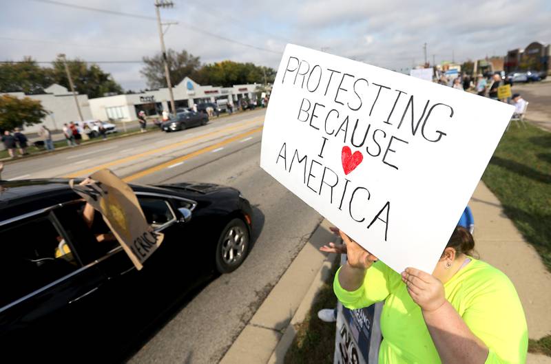 Protesters line Route 31 during a "No Kings” protest rally on Saturday, Oct. 18, 2025, in McHenry. The protest drew thousands of protesters to the area to protest the policies of President Donald Trump.